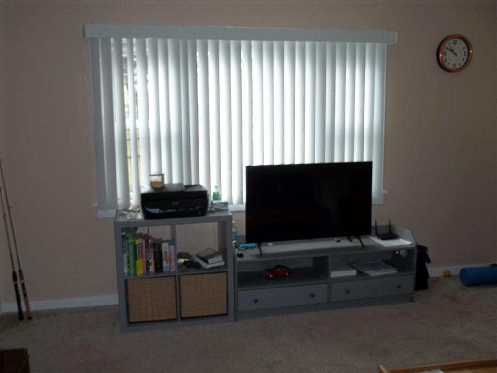 402 McCoy Road McKees Rocks, PA 15136 - Photo 4 of 20 a living room with furniture and a flat screen tv
