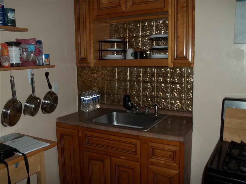 402 McCoy Road McKees Rocks, PA 15136 - Photo 8 of 20 a kitchen with a sink and cabinets