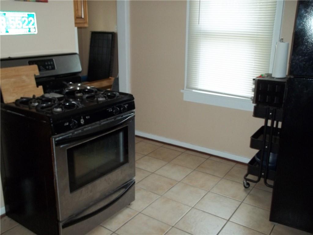 402 McCoy Road McKees Rocks, PA 15136 - Photo 9 of 20 a kitchen with a stove and a microwave