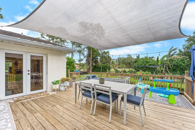 a view of a dining tables and chairs in a patio
