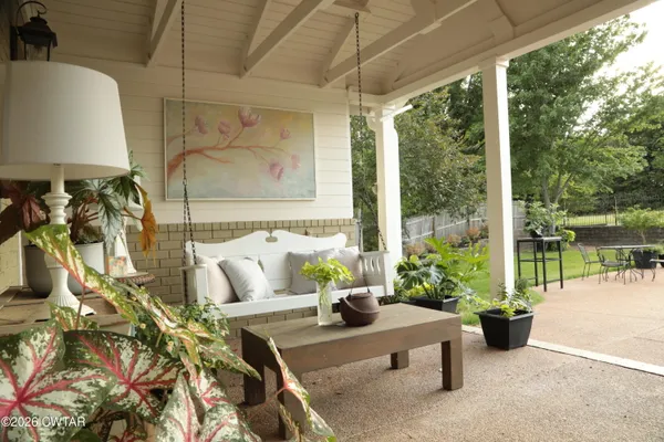 a view of a chairs and table in a patio