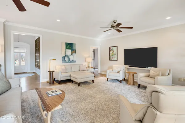 a living room with furniture and a flat screen tv