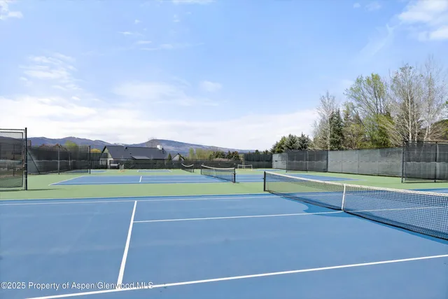 a view of an outdoor space and tennis court