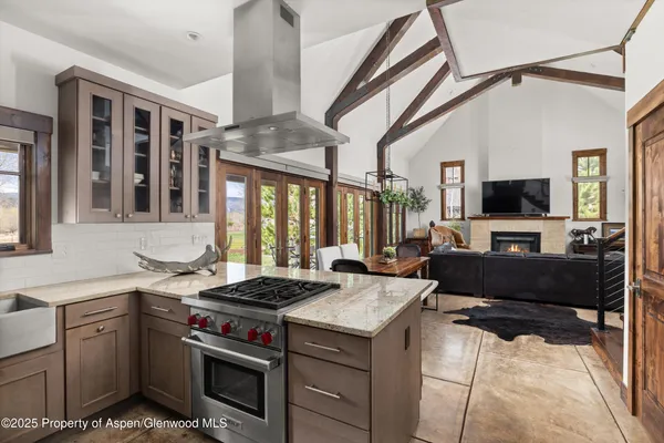a kitchen with a stove and a sink