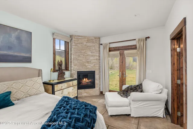 a spacious bedroom with a bed and a couch