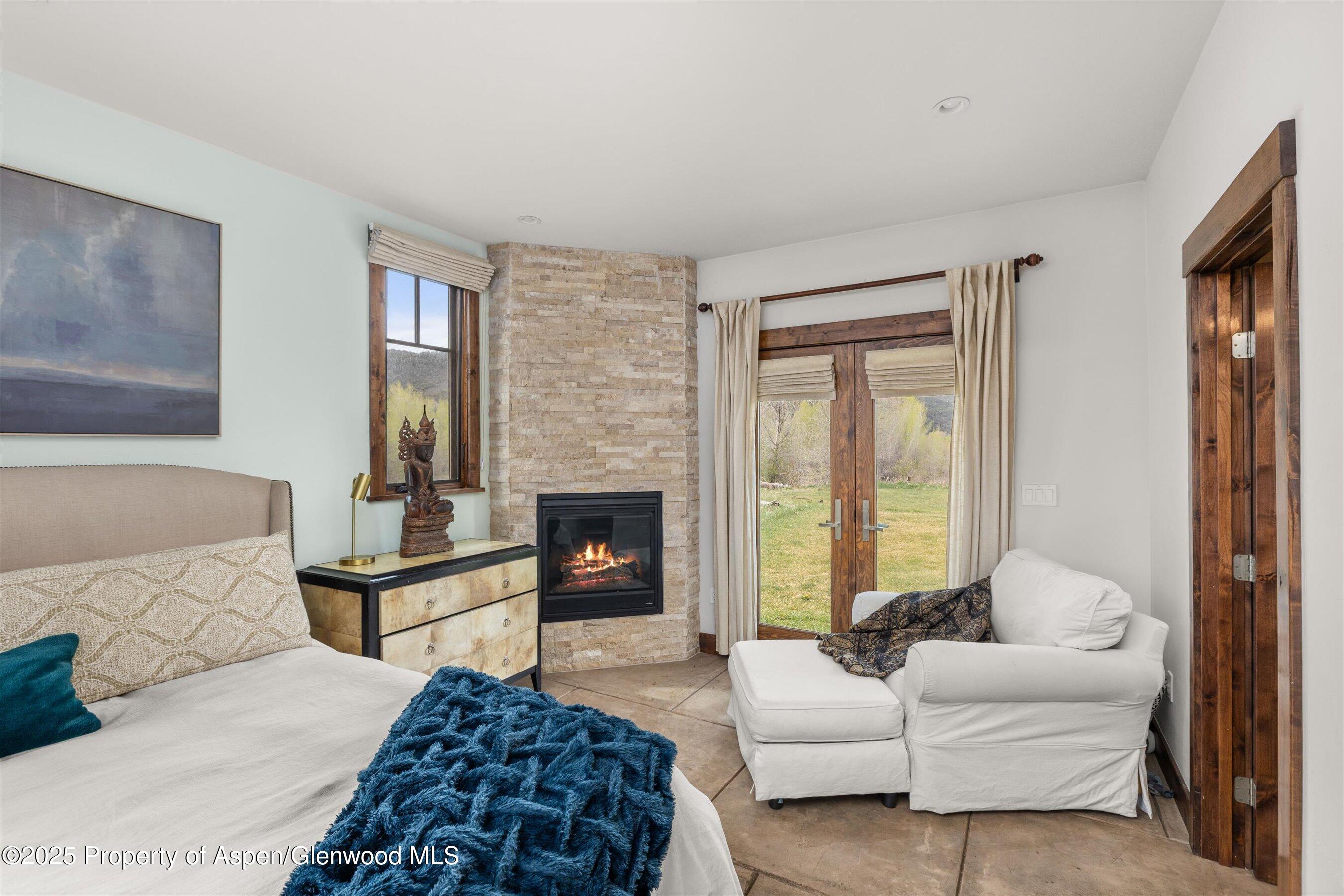 160 Equestrian Way Carbondale, CO 81623 - Photo 10 of 36 a spacious bedroom with a bed and a couch