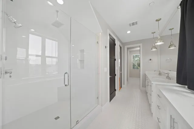 a bathroom with a sink vanity and toilet