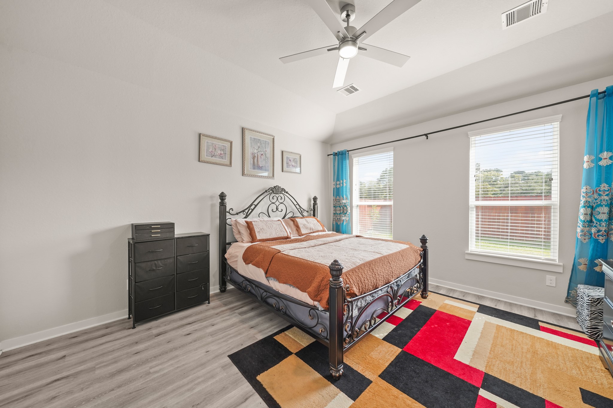 18419 Windy Knl Way Houston, TX 77084 - Photo 18 of 50 a bedroom with a bed and wooden floor