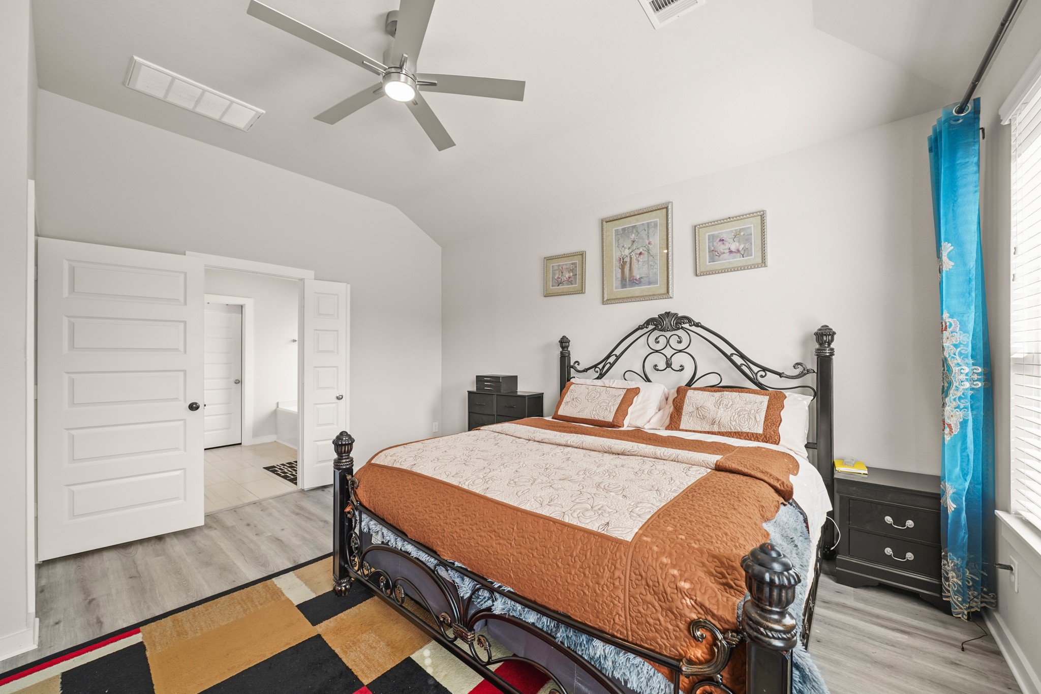 18419 Windy Knl Way Houston, TX 77084 - Photo 19 of 50 a bedroom with a bed and wooden floor