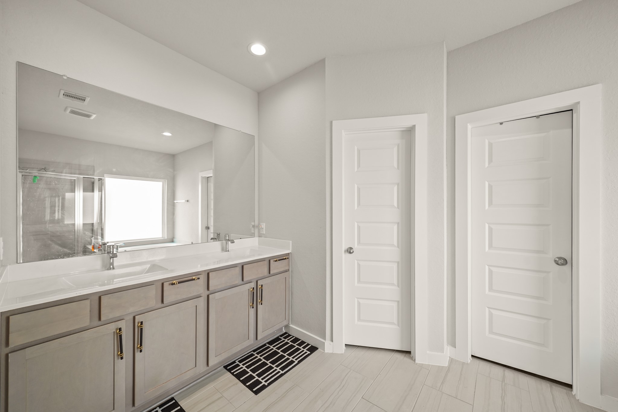 18419 Windy Knl Way Houston, TX 77084 - Photo 20 of 50 a bathroom with a sink and a mirror