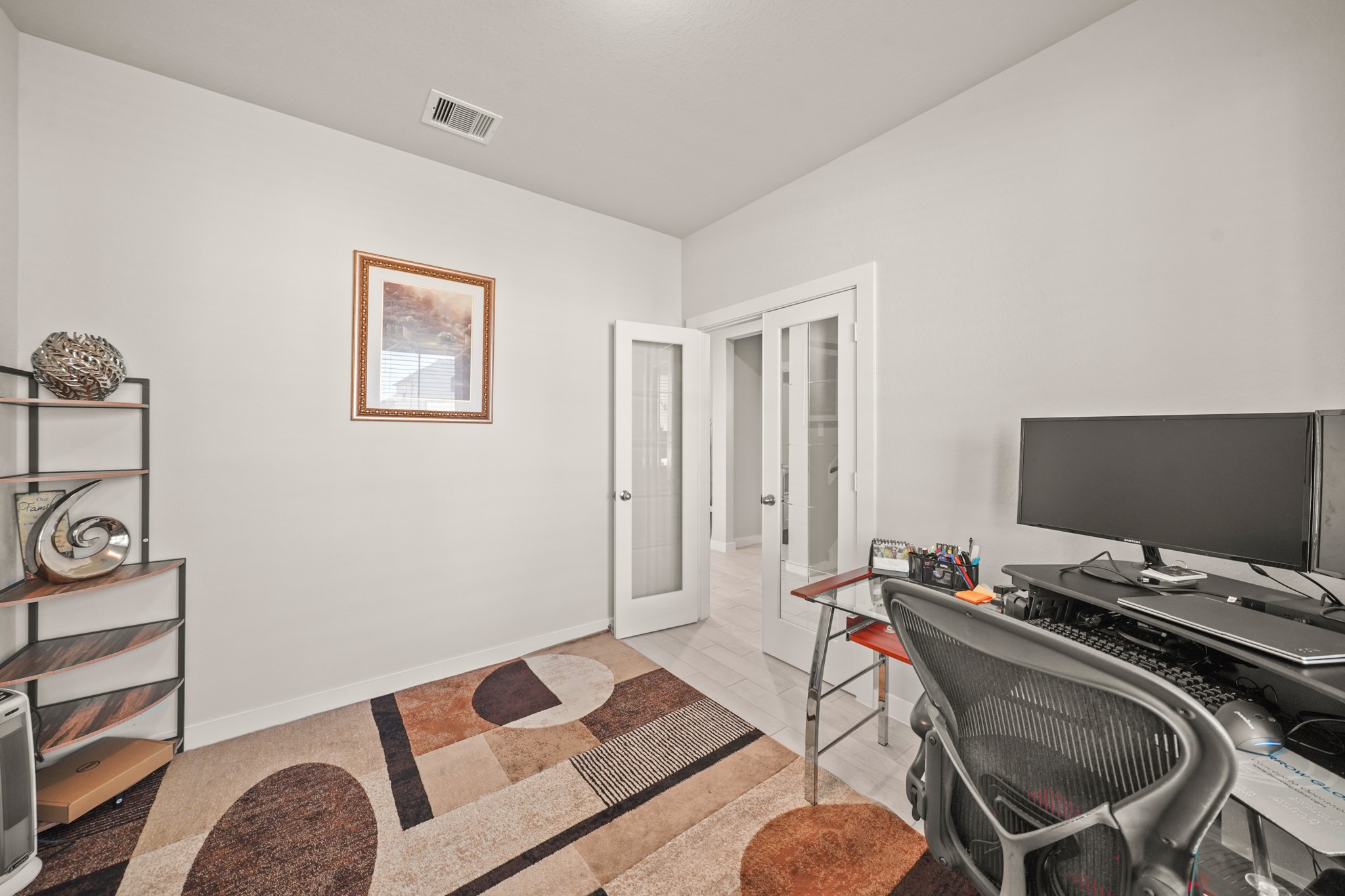 18419 Windy Knl Way Houston, TX 77084 - Photo 2 of 50 a bedroom with a bed and a desk