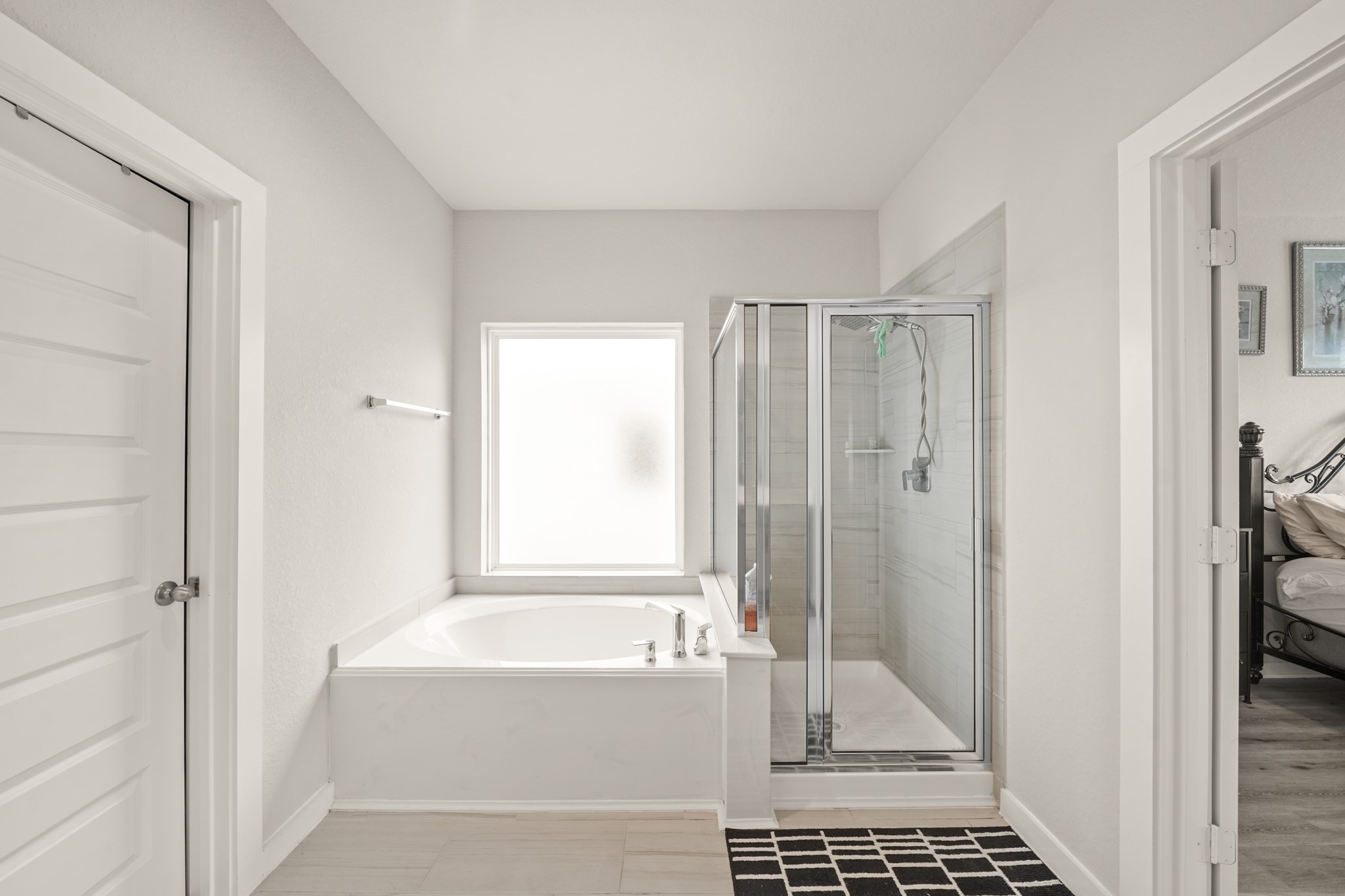 18419 Windy Knl Way Houston, TX 77084 - Photo 21 of 50 a bathroom with a bathtub and a shower