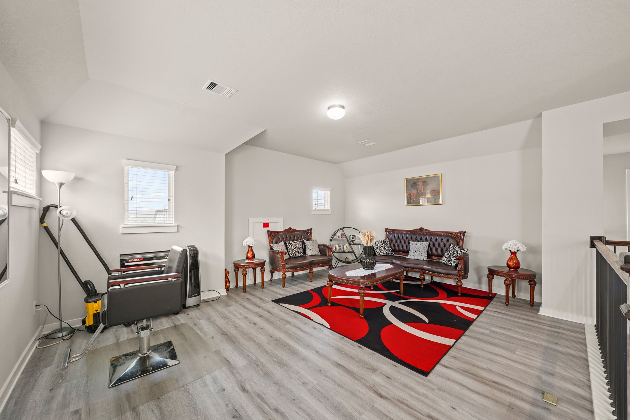 18419 Windy Knl Way Houston, TX 77084 - Photo 22 of 50 a living room with furniture a flat screen tv and a wooden floor
