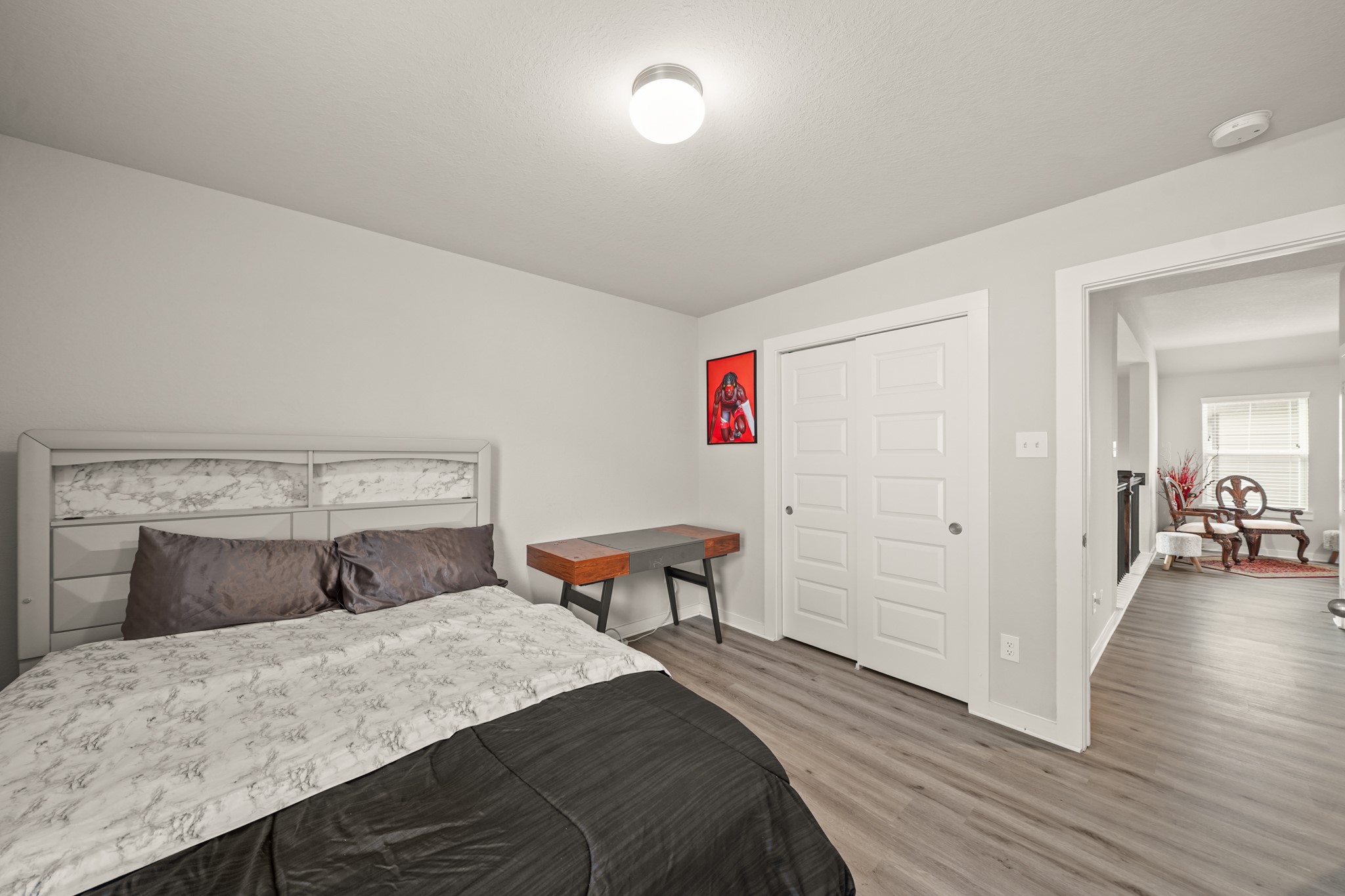 18419 Windy Knl Way Houston, TX 77084 - Photo 26 of 50 a bedroom with a bed and wooden floor