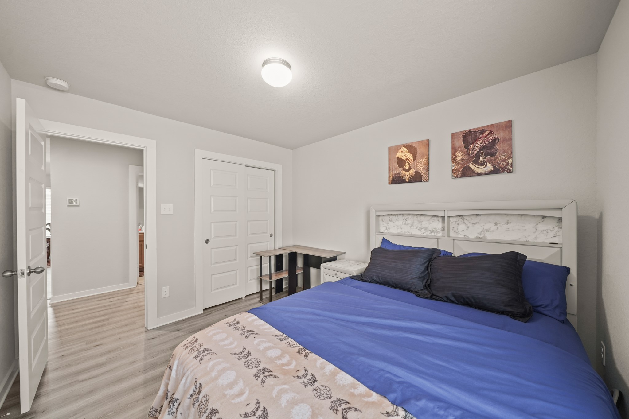 18419 Windy Knl Way Houston, TX 77084 - Photo 28 of 50 a bedroom with a bed and a fireplace