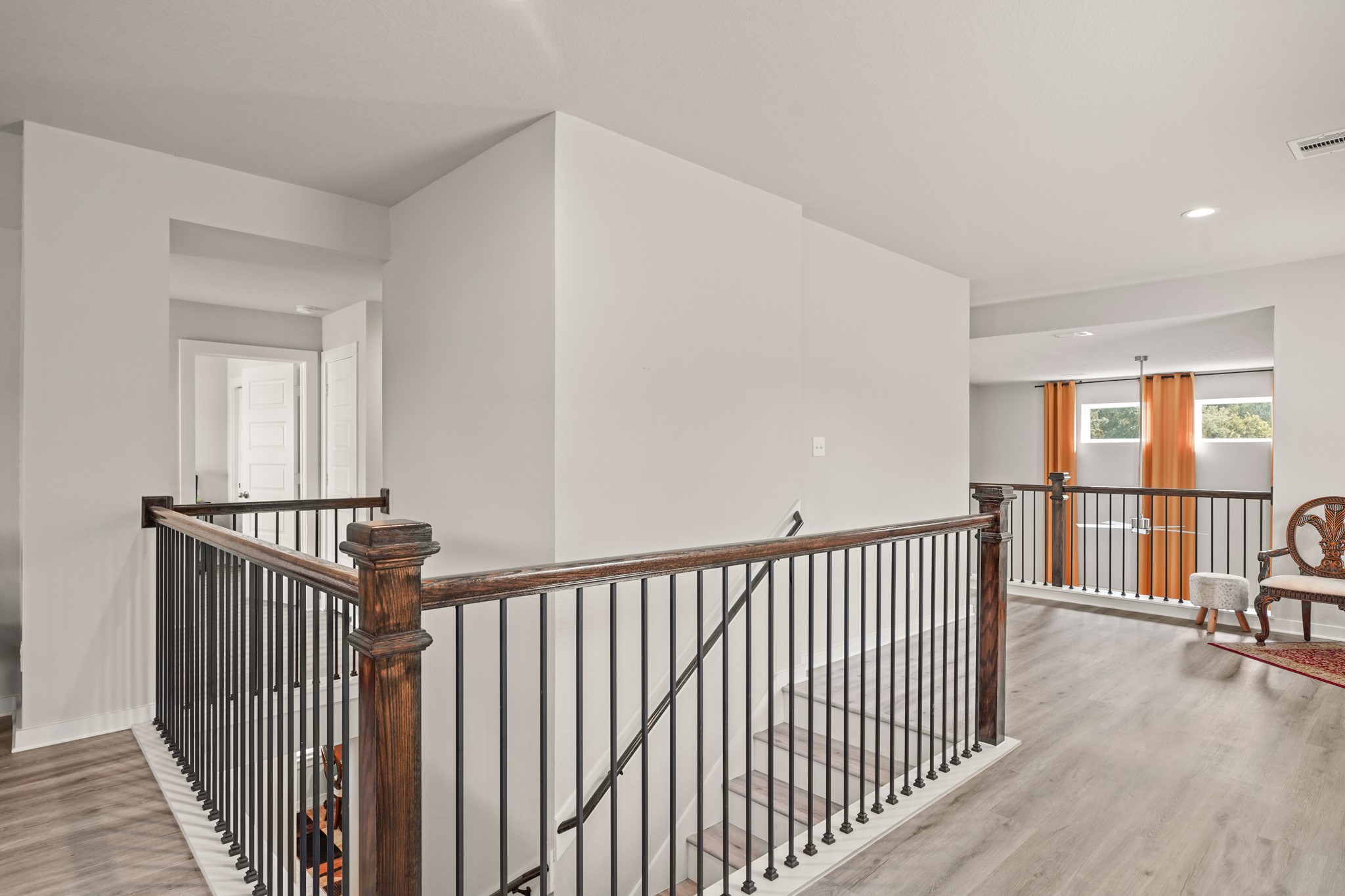 18419 Windy Knl Way Houston, TX 77084 - Photo 31 of 50 a view of a hallway with wooden floor and windows
