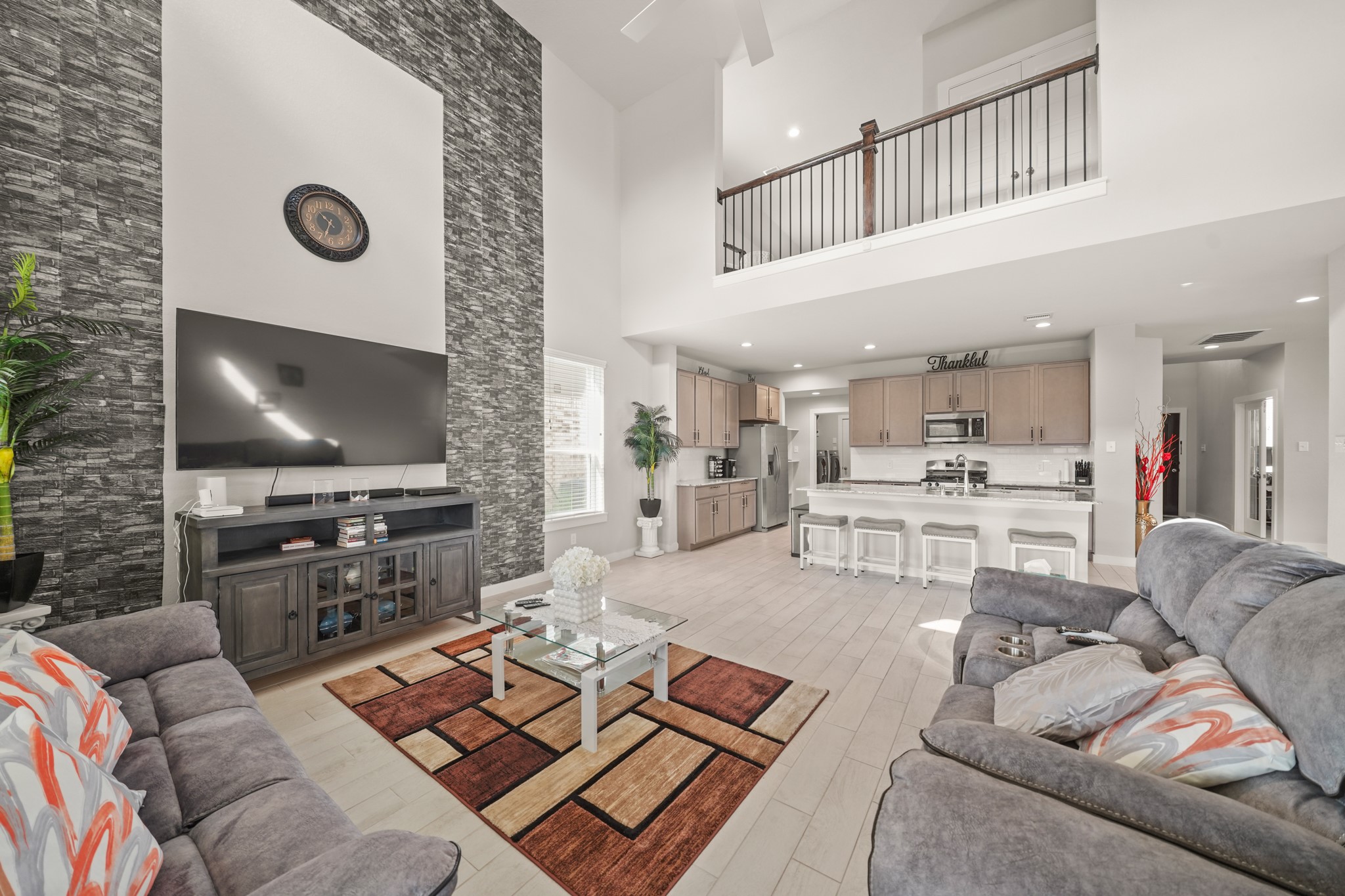 18419 Windy Knl Way Houston, TX 77084 - Photo 4 of 50 a living room with furniture and a flat screen tv
