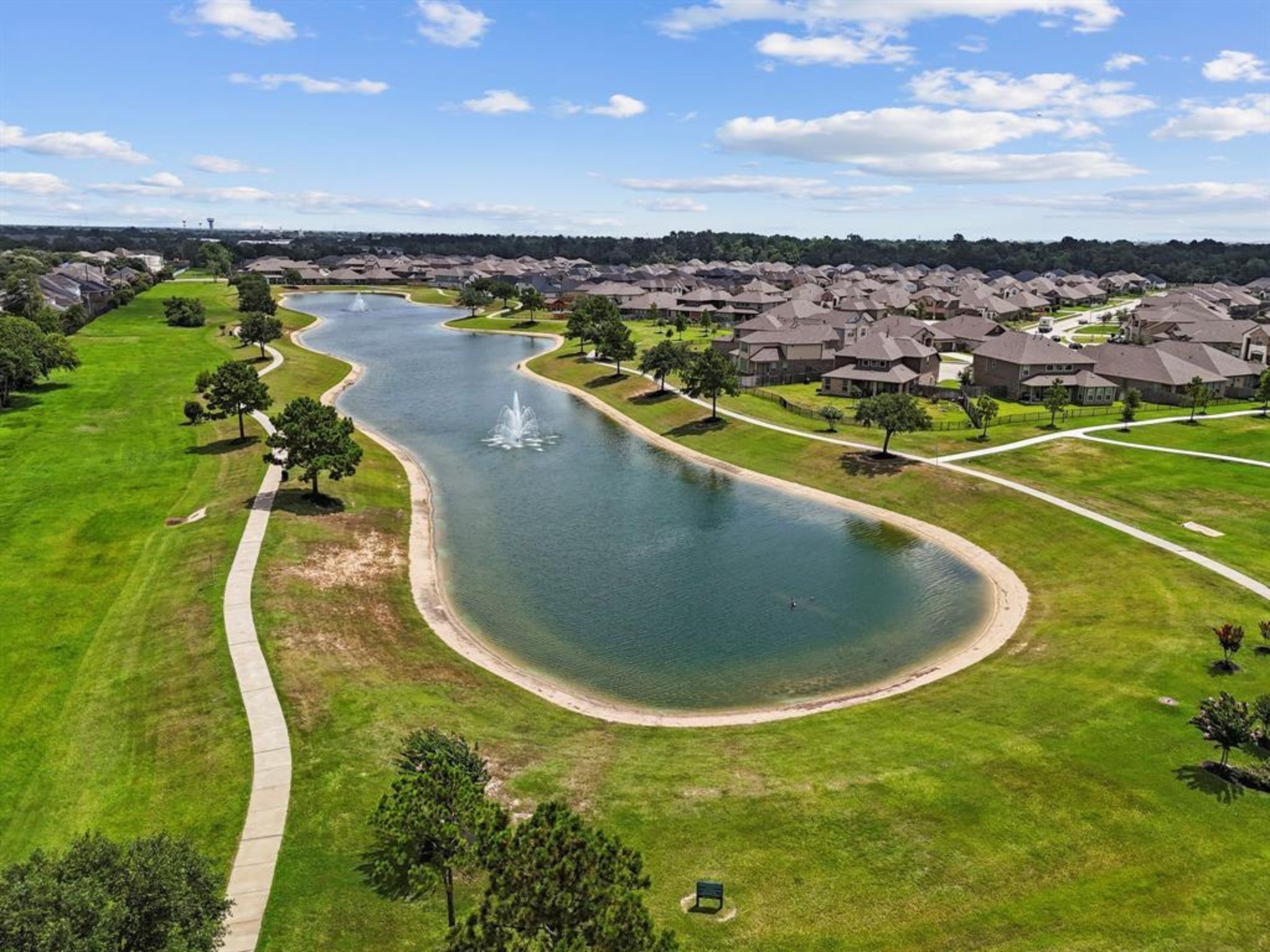 18419 Windy Knl Way Houston, TX 77084 - Photo 45 of 50 a view of a swimming pool and lake