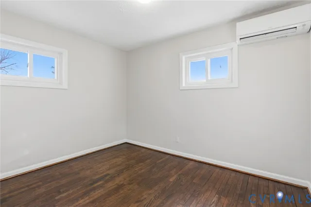a view of a room that has wooden floor in it