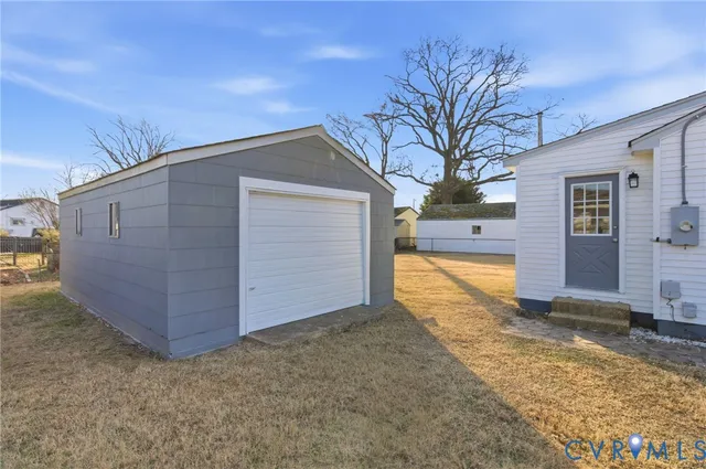 a view of backyard with large tree