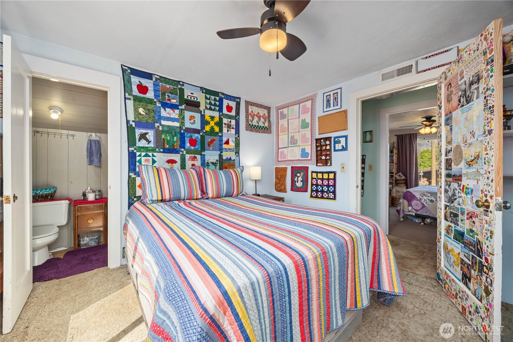 1281 Totem Pole Road Manson, WA 98831 - Photo 14 of 39 a bedroom with a bed and a chandelier