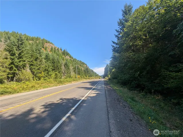 a view of a road with a yard