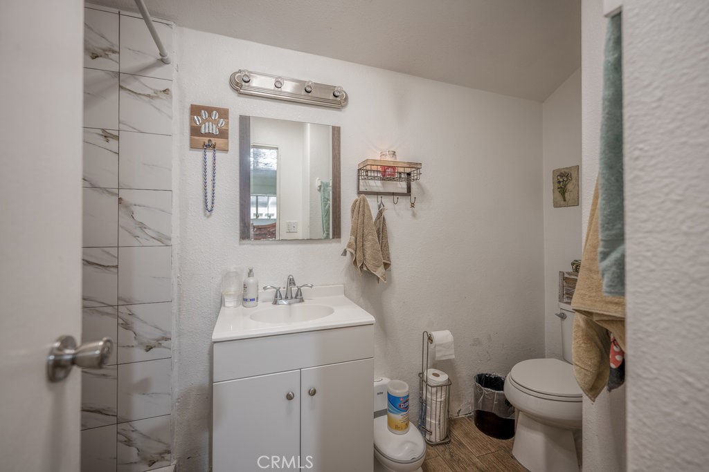 9555 1/2 Hierba Road Agua Dulce, CA 91390 - Photo 11 of 26 a bathroom with a sink toilet and shower