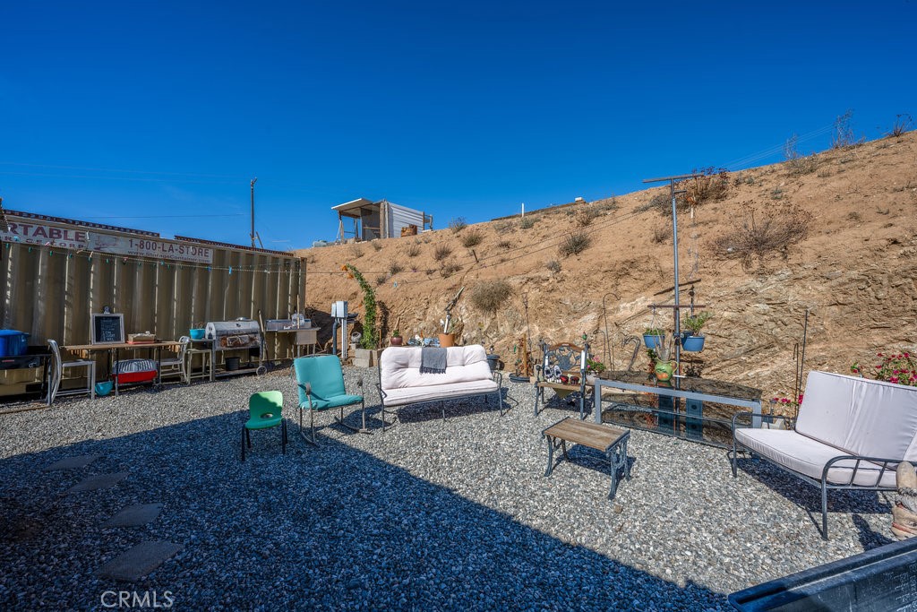 9555 1/2 Hierba Road Agua Dulce, CA 91390 - Photo 18 of 26 a view of a backyard with sitting area