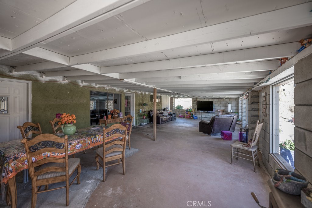 9555 1/2 Hierba Road Agua Dulce, CA 91390 - Photo 4 of 26 a living room with lots of furniture and a flat screen tv