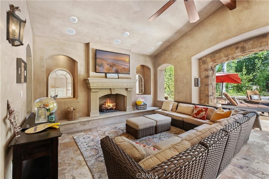 25 Vía Terracaleta Coto de Caza, CA 92679 - Photo 20 of 23 a living room with furniture fireplace and a large window