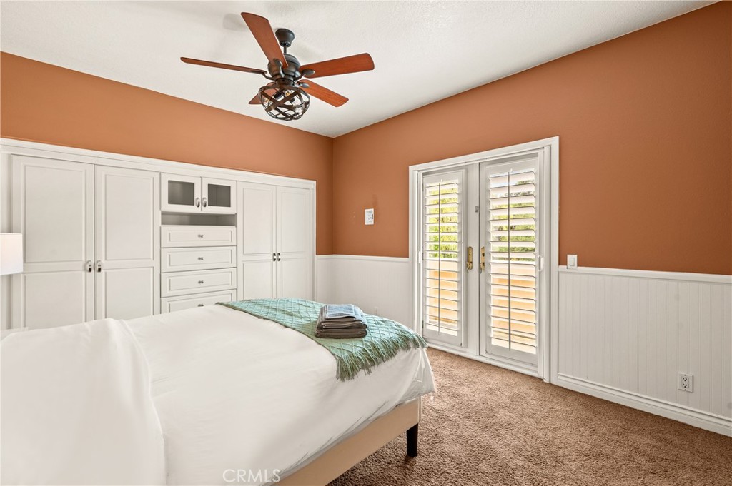 25 Vía Terracaleta Coto de Caza, CA 92679 - Photo 5 of 23 a bedroom with a bed and a chandelier