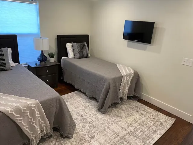 a bedroom with bed and a window