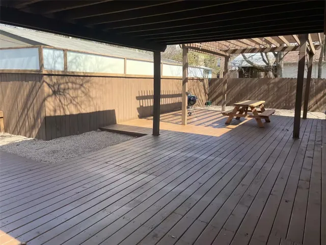 a sitting area with table and chairs