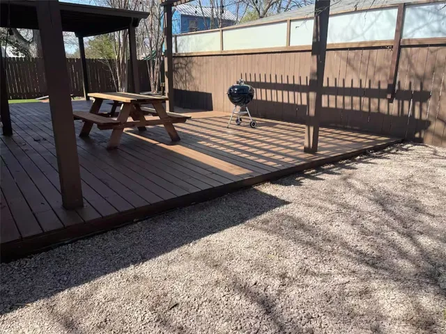 a view of a balcony with wooden floor