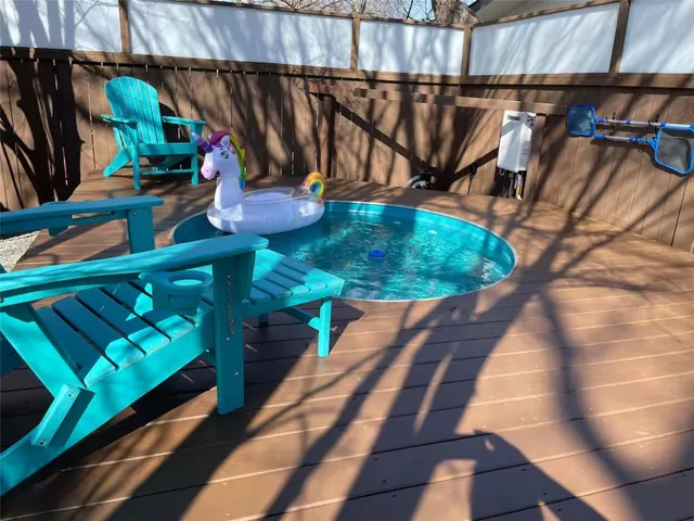 a view of table and chair under an umbrella