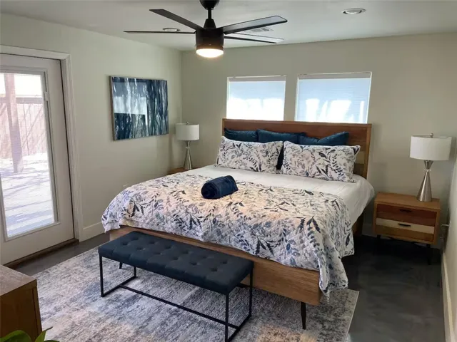 a kitchen with granite countertop a sink a counter space cabinets and stainless steel appliances