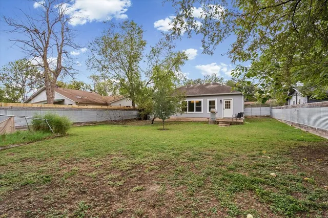 a view of house with yard and entertaining space
