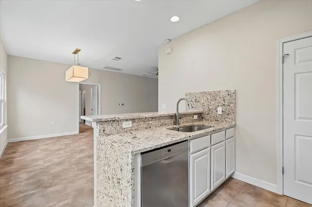a bathroom with a sink a vanity and a mirror