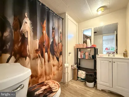 a view of a bathroom with tub and sink