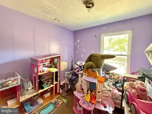 a room with toys and dresser