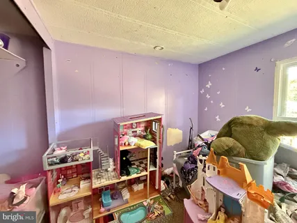 a view of gym equipment and children play room