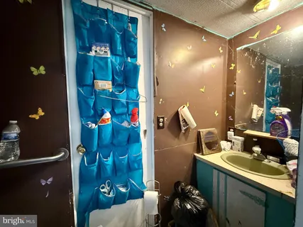 a bathroom with a sink vanity and mirror