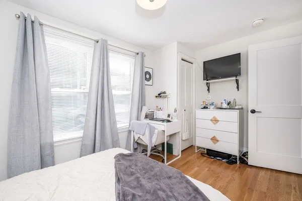 a room with a bed and a window