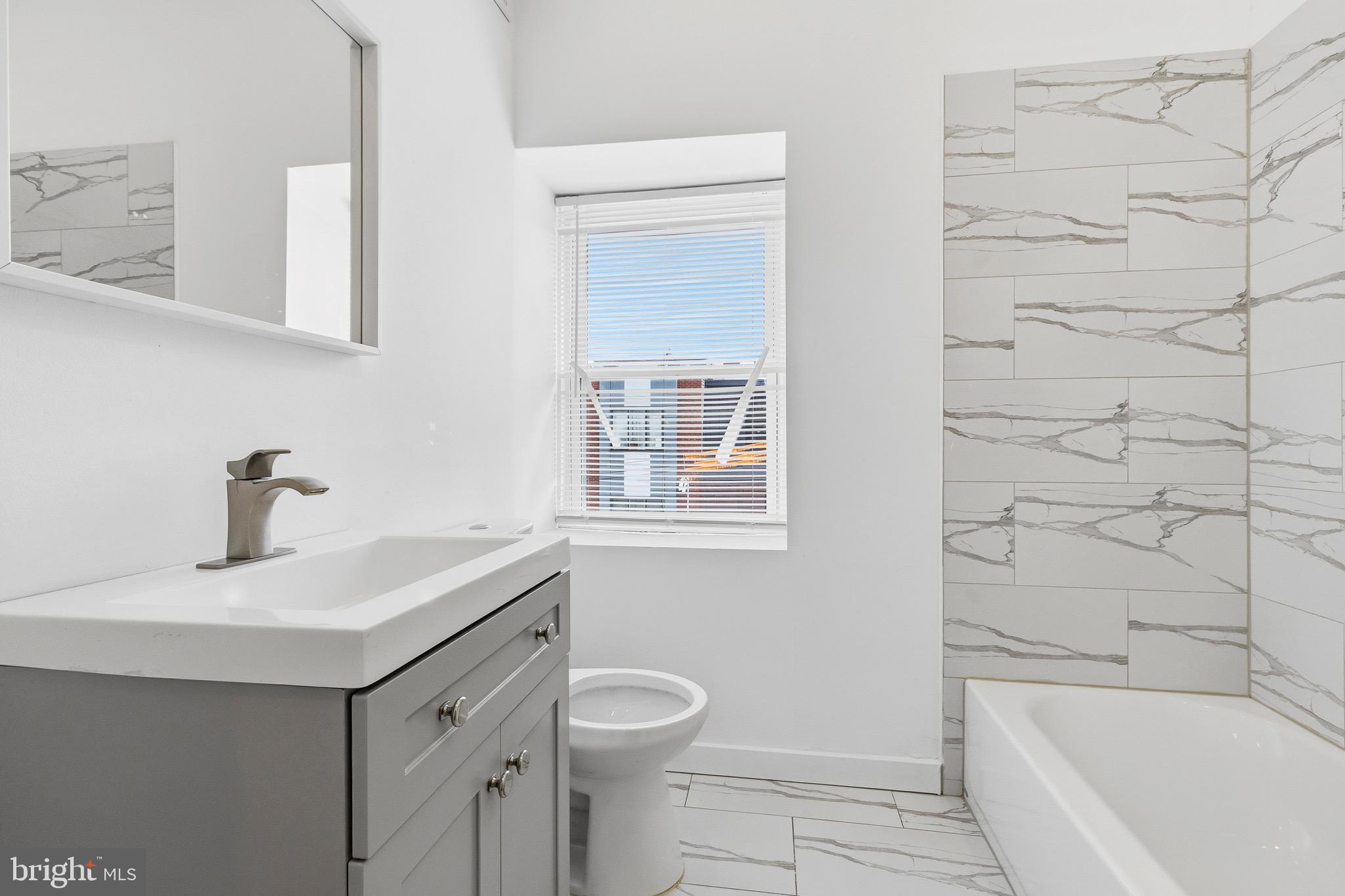 2150 North Franklin Street Philadelphia, PA 19122 - Photo 17 of 24 a bathroom with a sink toilet vanity and bathtub