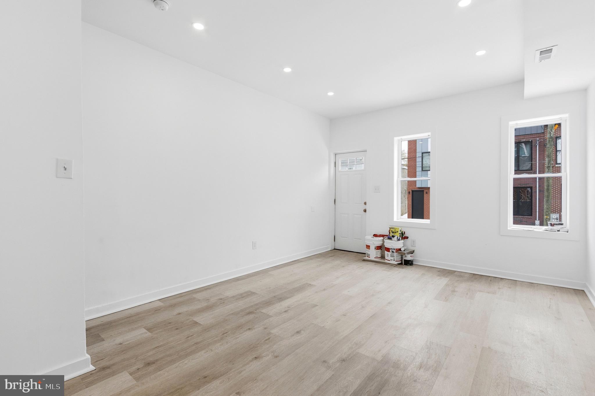 2150 North Franklin Street Philadelphia, PA 19122 - Photo 2 of 24 an empty room with wooden floor and windows