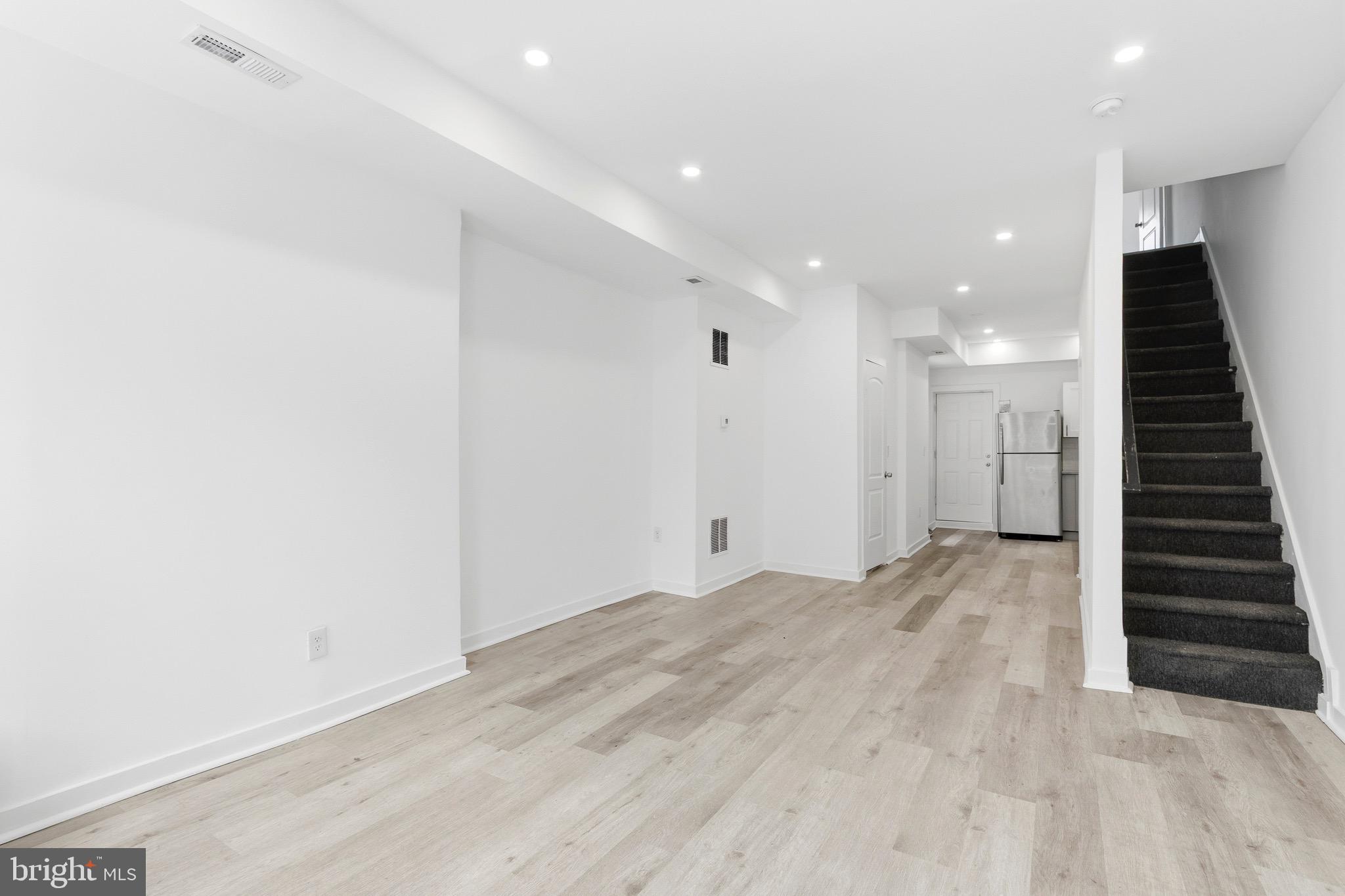 2150 North Franklin Street Philadelphia, PA 19122 - Photo 3 of 24 an empty room with wooden floor and entryway