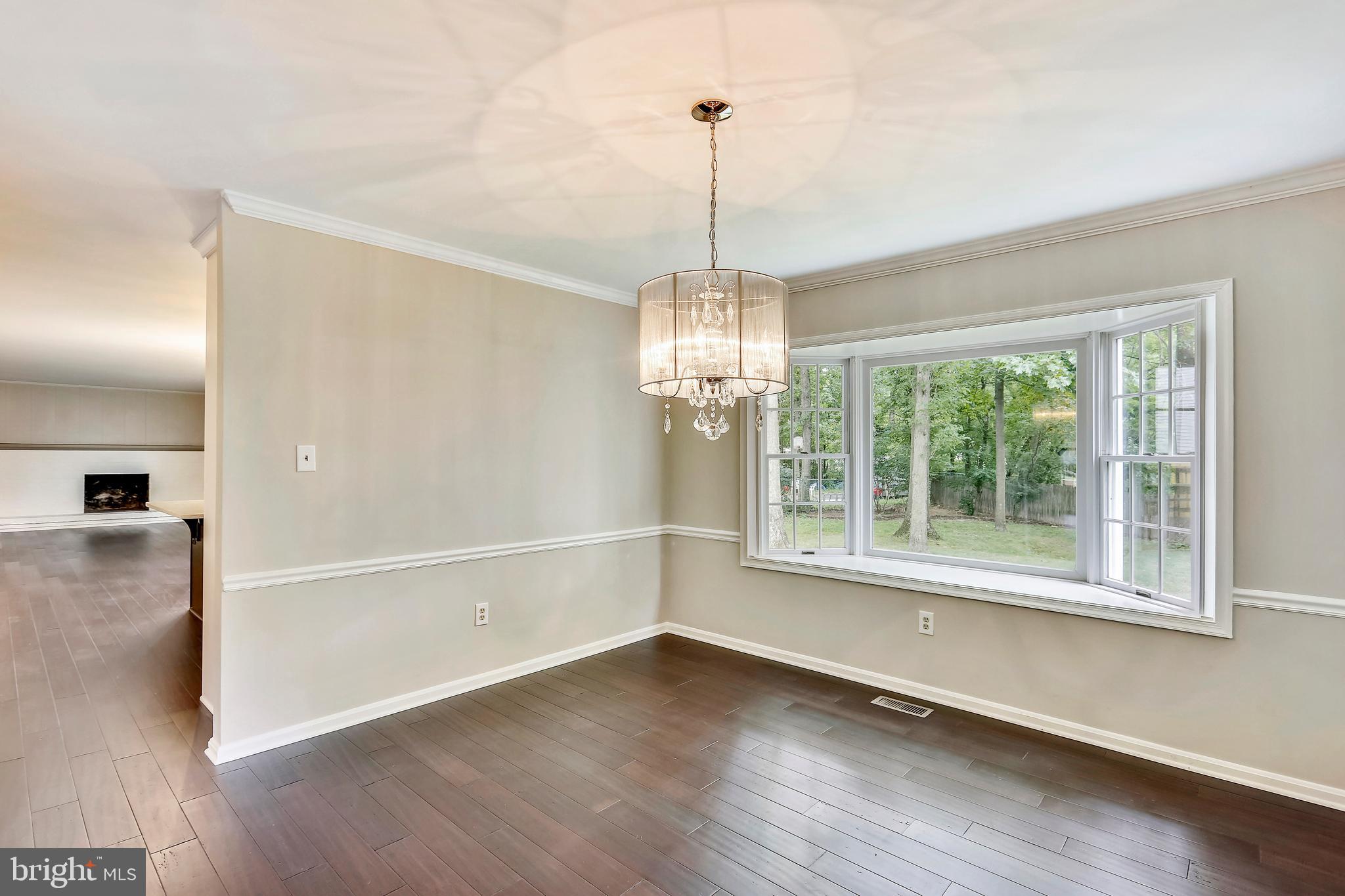 129 Summit Hall Road Gaithersburg, MD 20877 - Photo 13 of 48 Dining room with crown moulding and chair rail