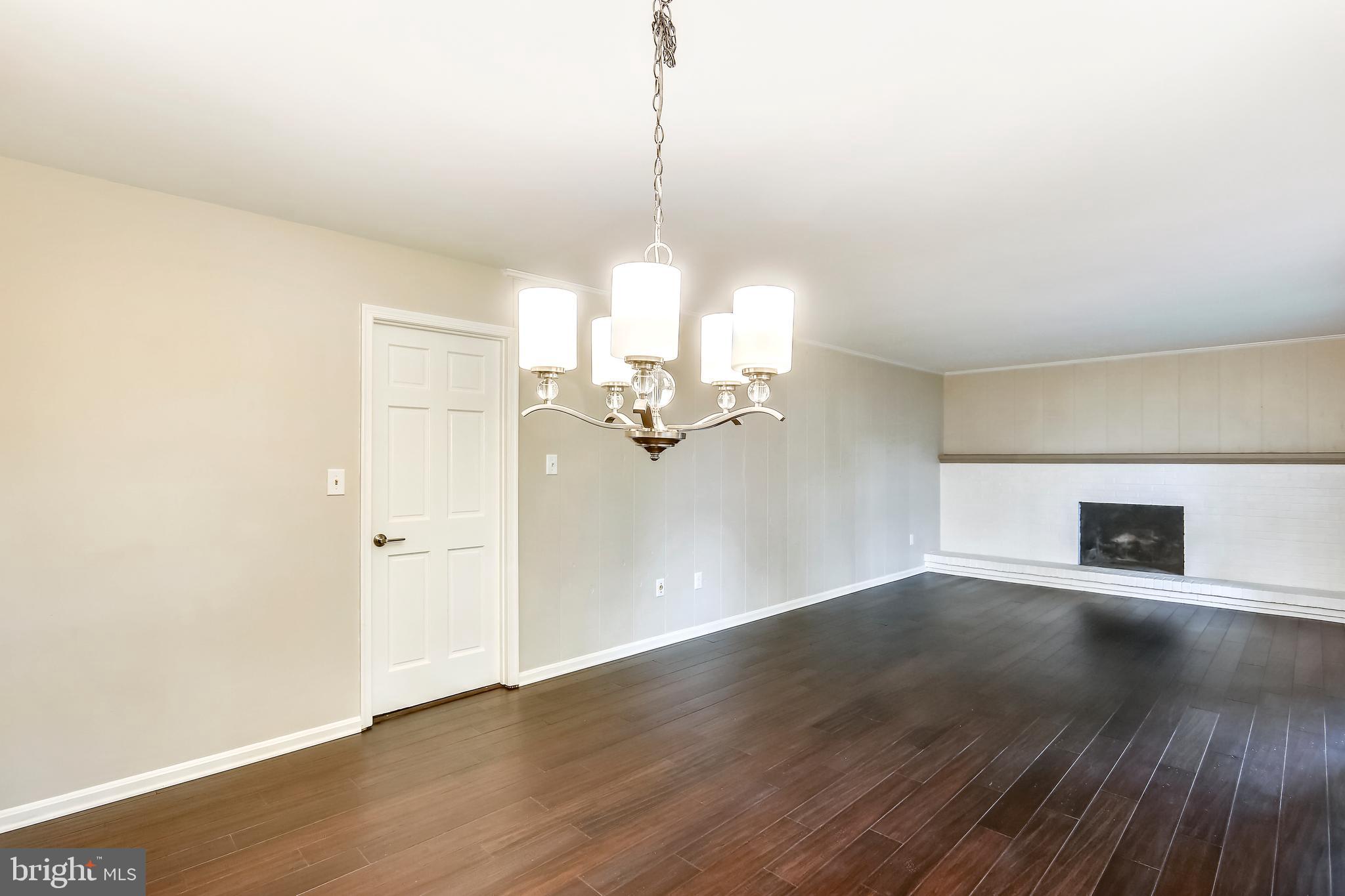 129 Summit Hall Road Gaithersburg, MD 20877 - Photo 20 of 48 Family room with brick wood burning fireplace