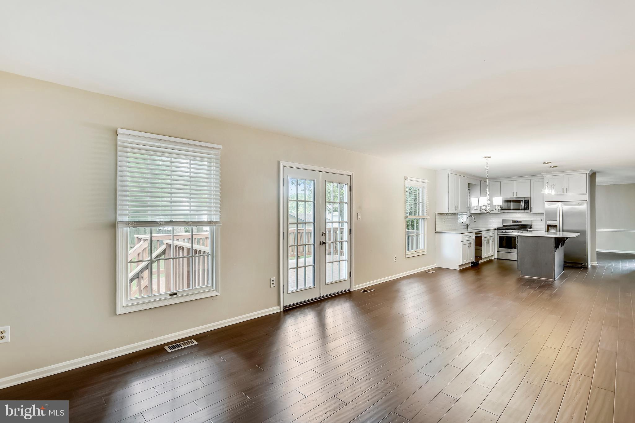 129 Summit Hall Road Gaithersburg, MD 20877 - Photo 22 of 48 Family room with NEW French doors to deck