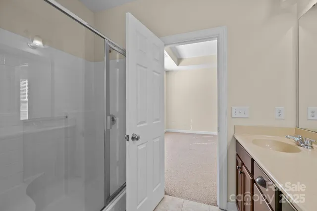 a bathroom with a sink and a shower